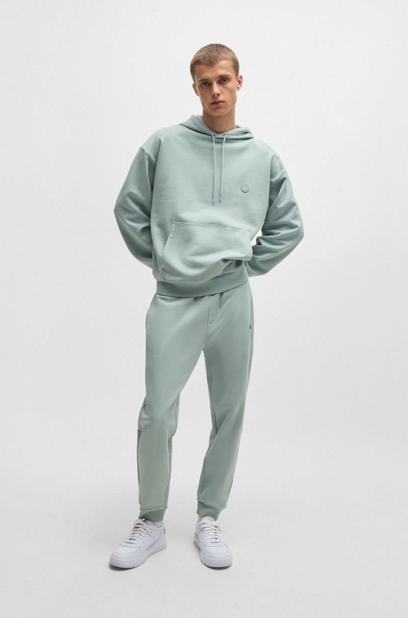 HUGO COTTON-TERRY TRACKSUIT BOTTOMS WITH BLUE LOGO PATCH outlook