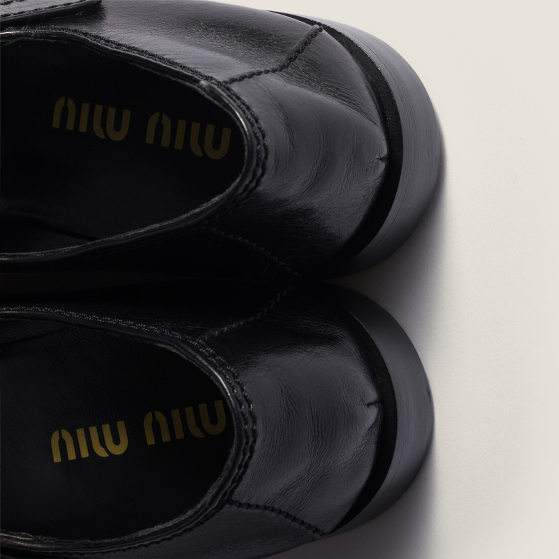 Miu Miu Leather loafers with strap outlook