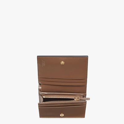 FENDI Small bi-fold F is Fendi wallet. Interior organized with flat pockets, a coin pocket with zip, four  outlook