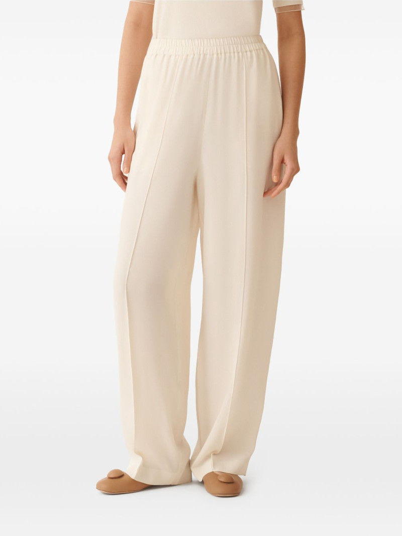elasticated-waist pocket trousers 1