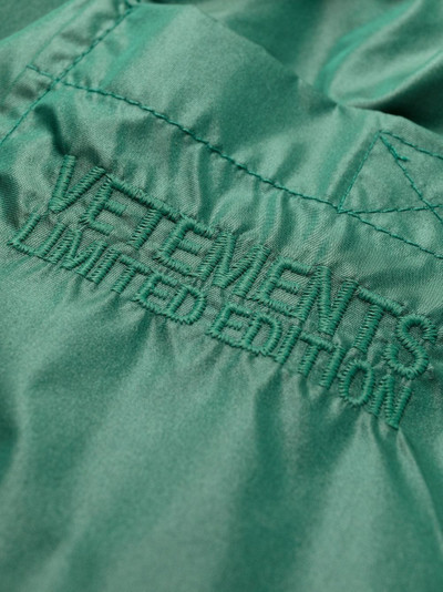 VETEMENTS slogan-print swim shorts outlook