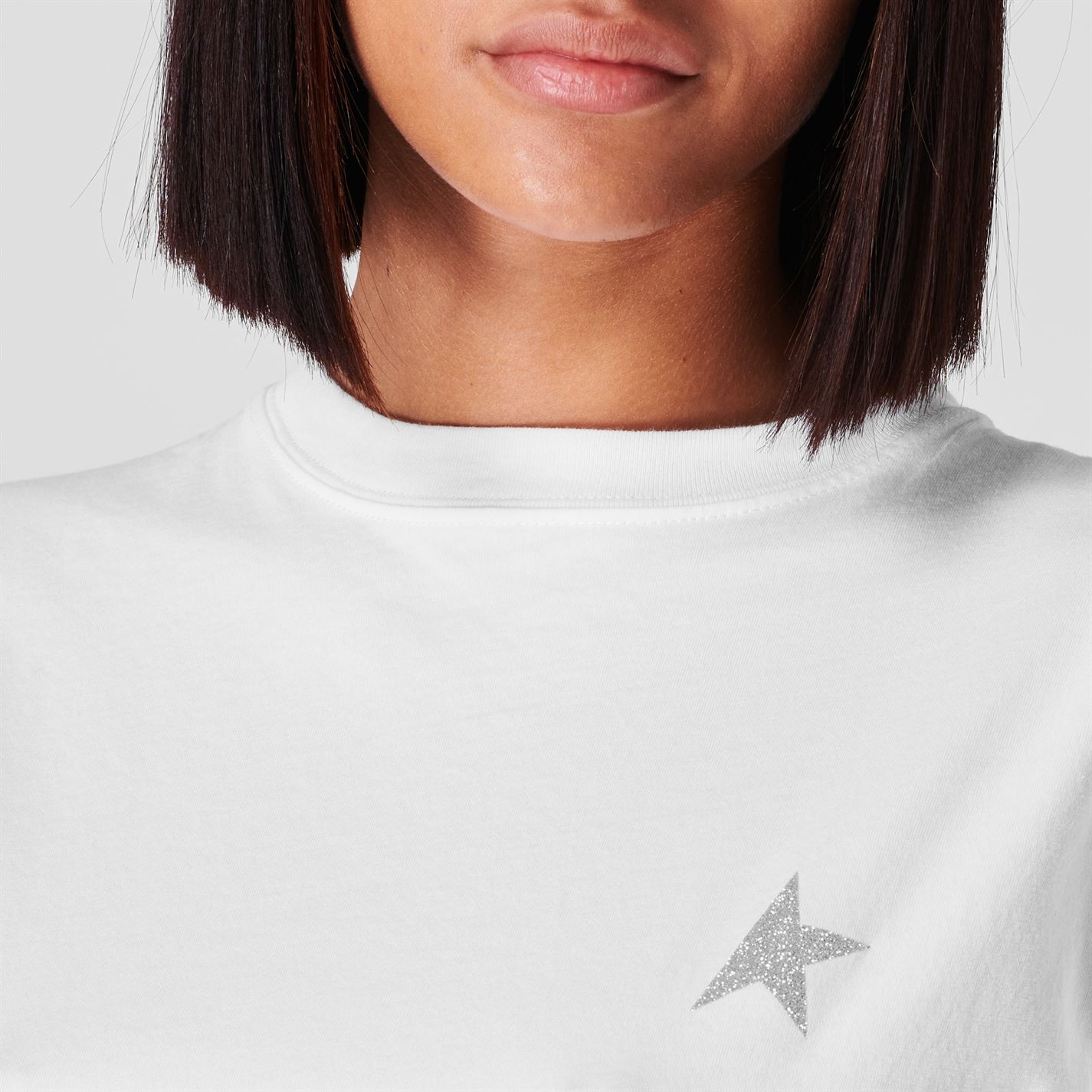 Women's white T-shirt with pink glitter logo and star