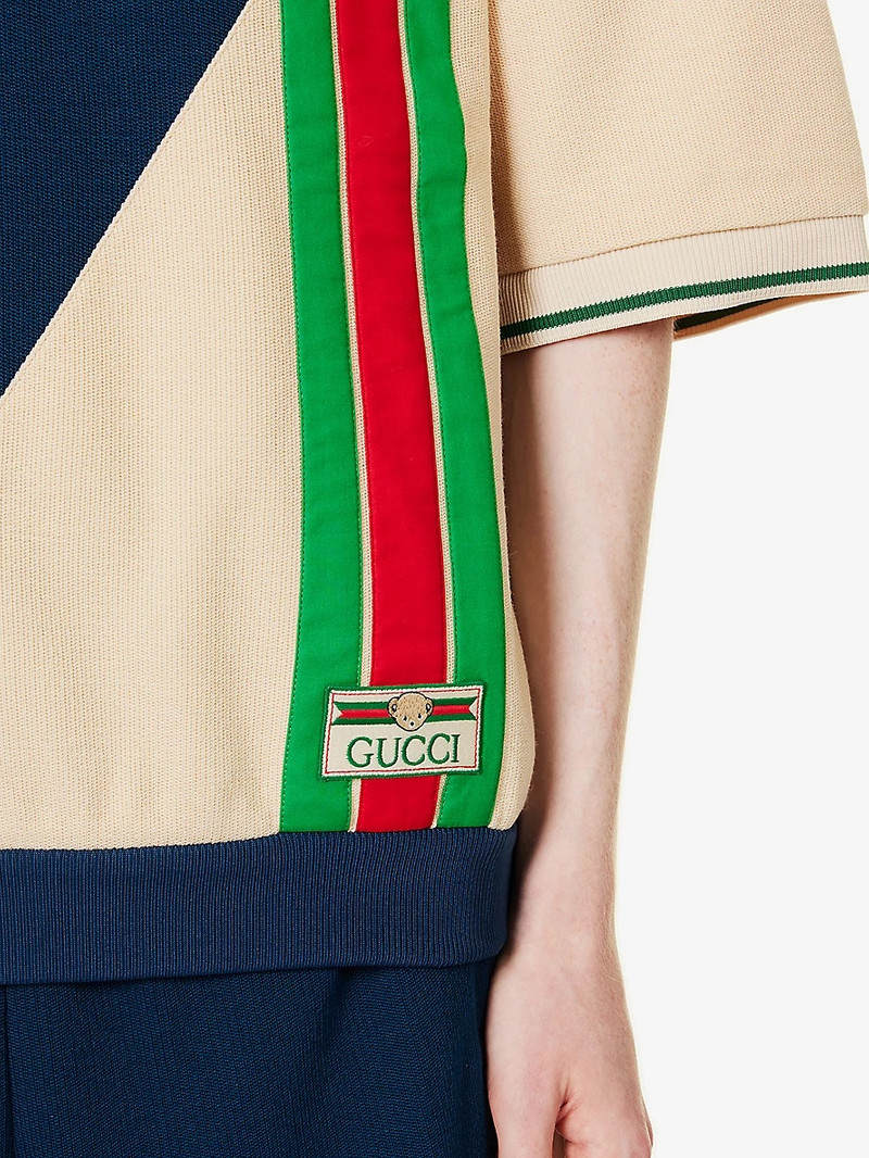 Logo-patch striped wool and cotton-blend polo shirt 5