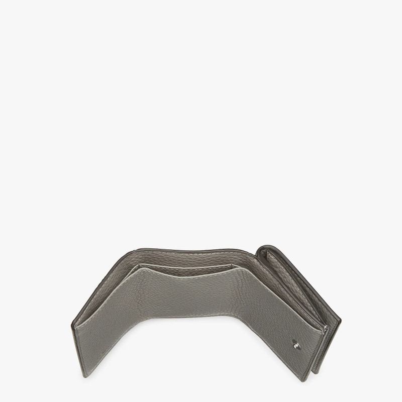 Wallet with two internal compartments for bank notes and outer pocket with press stud fastening. Mad 4