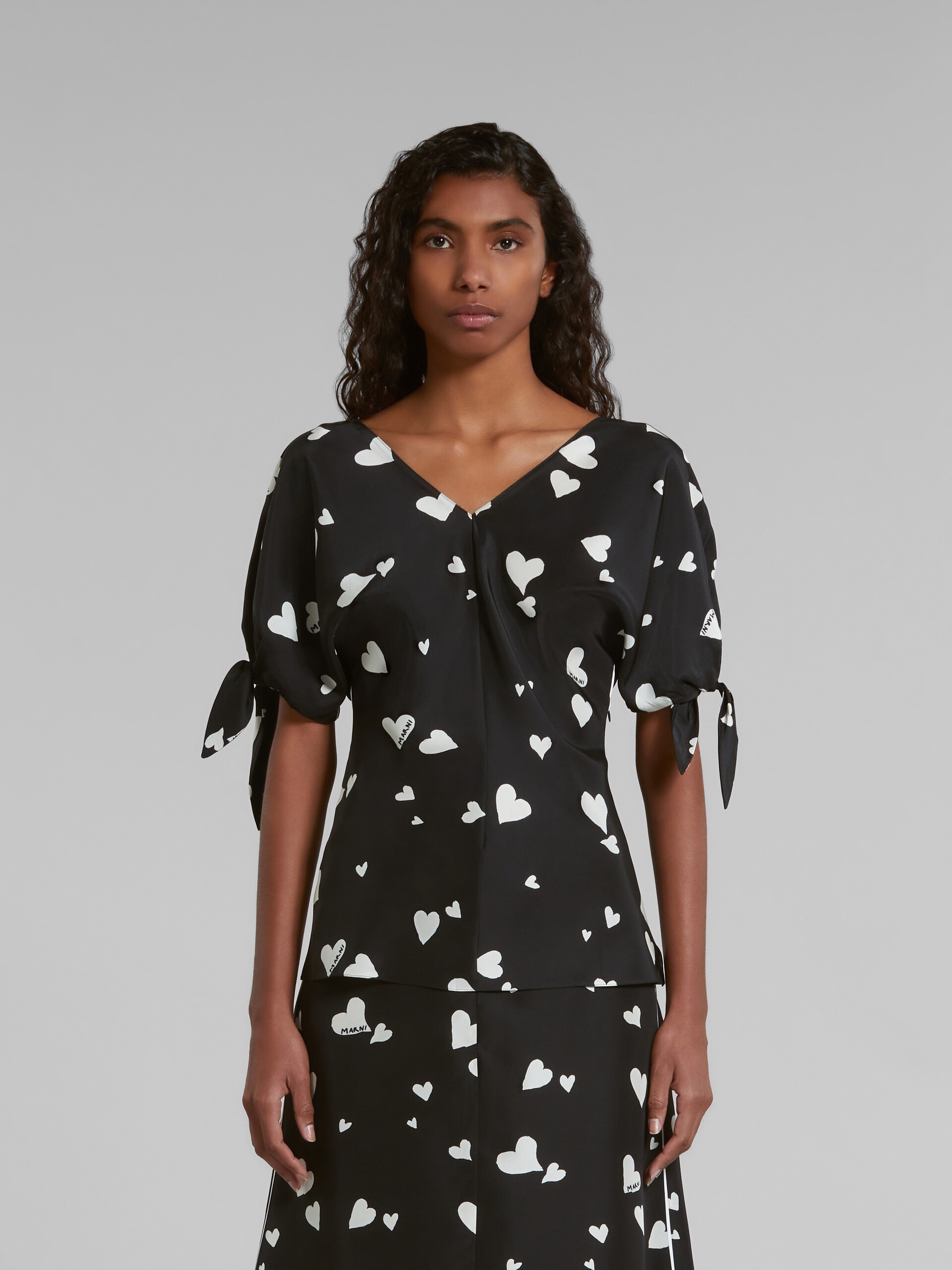 BLACK SILK BOW-SLEEVE TOP WITH BUNCH OF HEARTS PRINT - 2