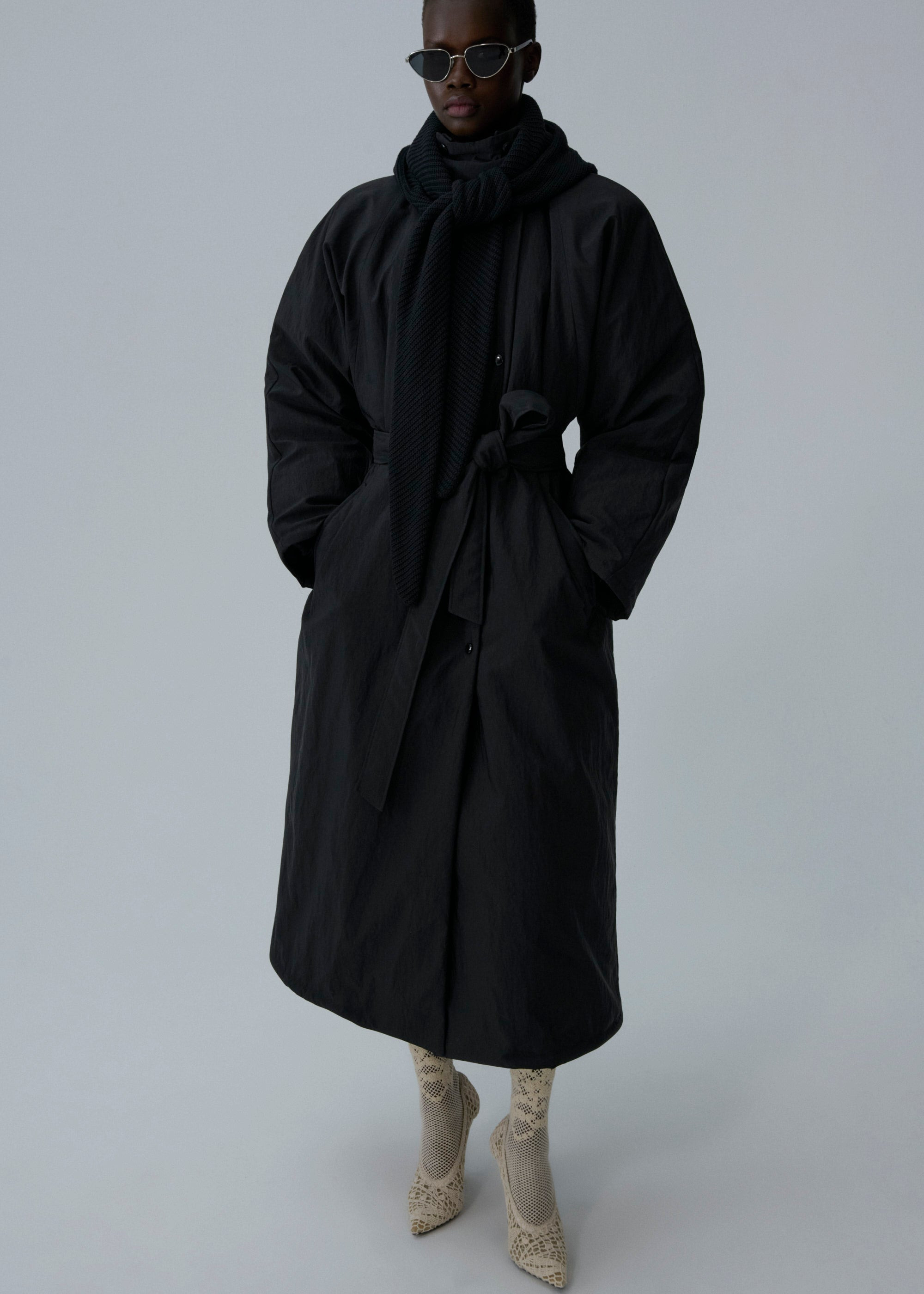 Knit hood long puffer coat in black - 3