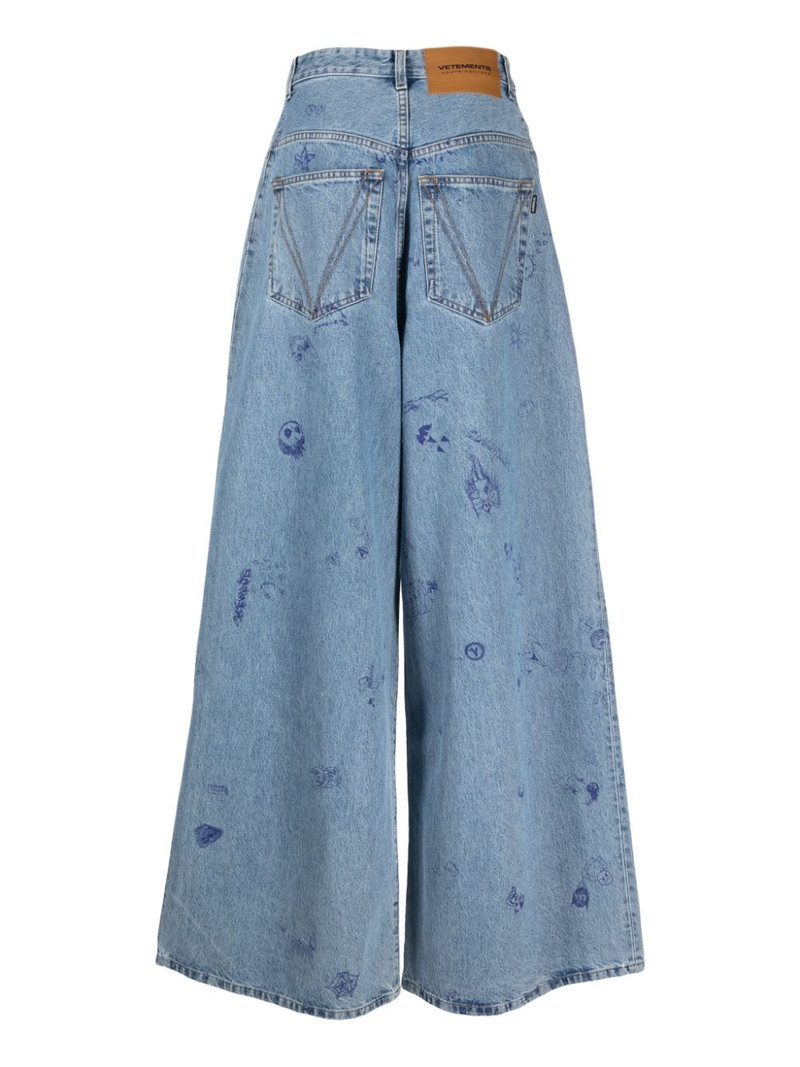 VETEMENTS illustration-style print wide-leg jeans outlook