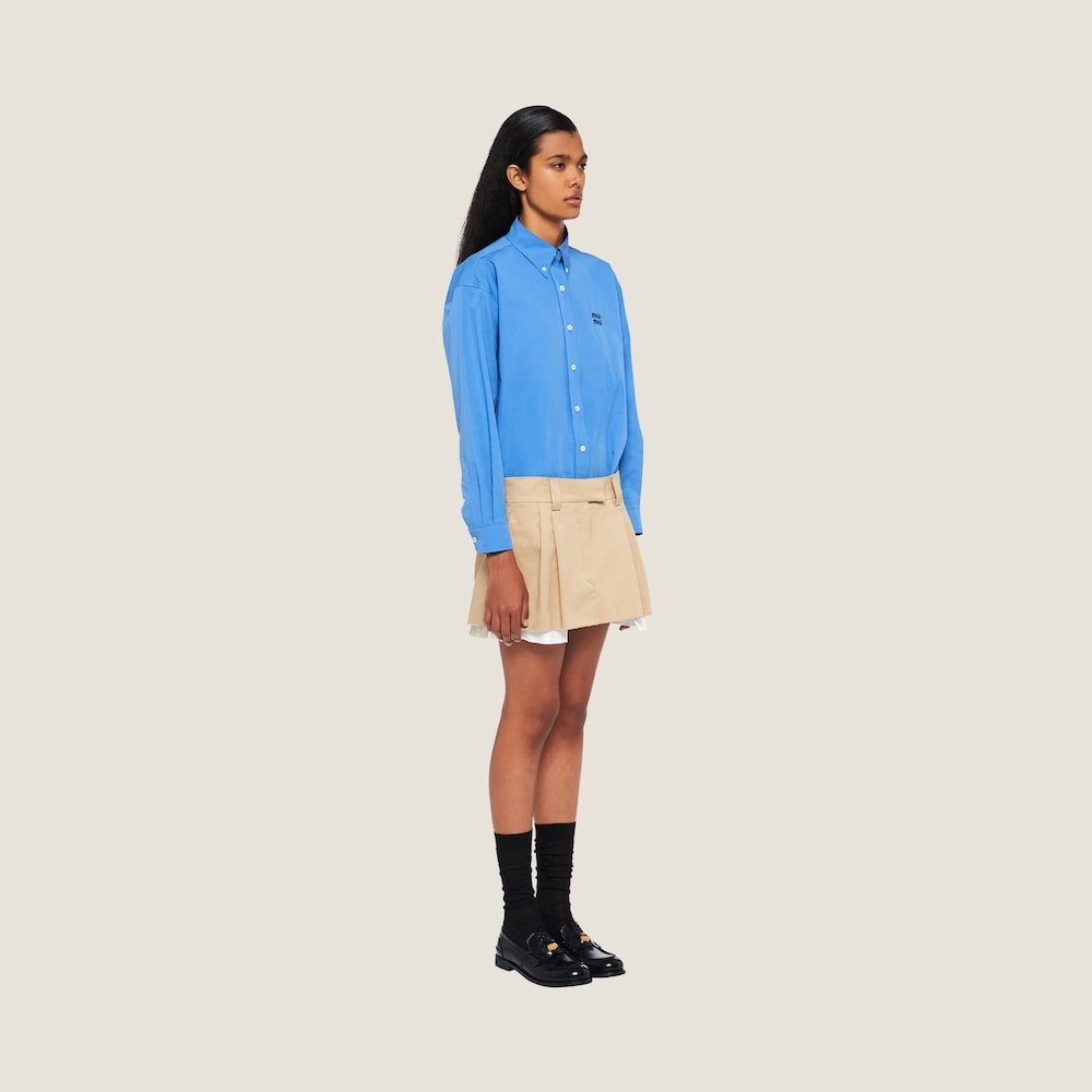 スカート MIUMIU LOGO PATCH GABARDINE MINISKIRT Miu Miu logo-embroidered Denim Miniskirt | Grey | FARFETCH