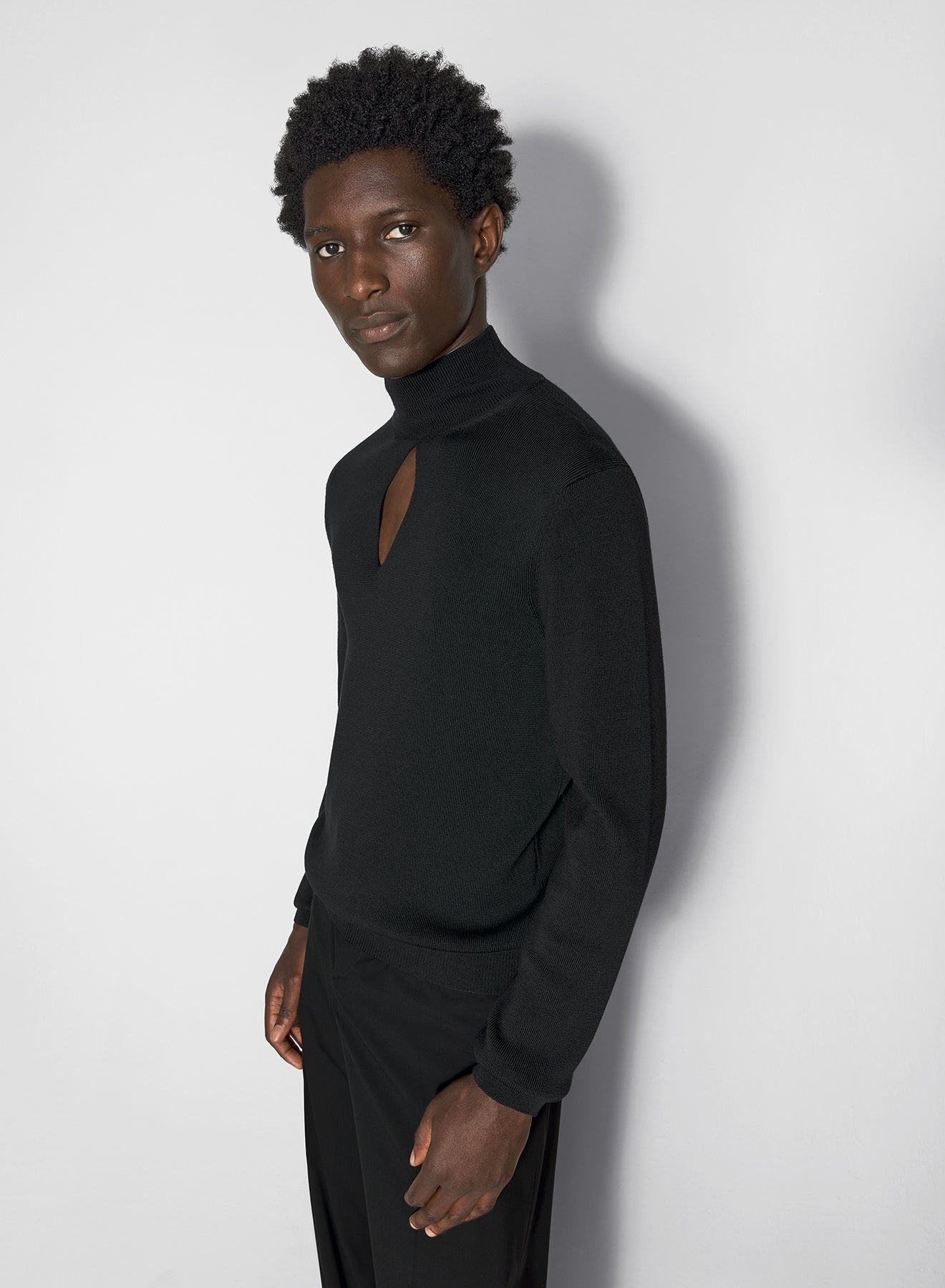 black cut-out knit top - 1
