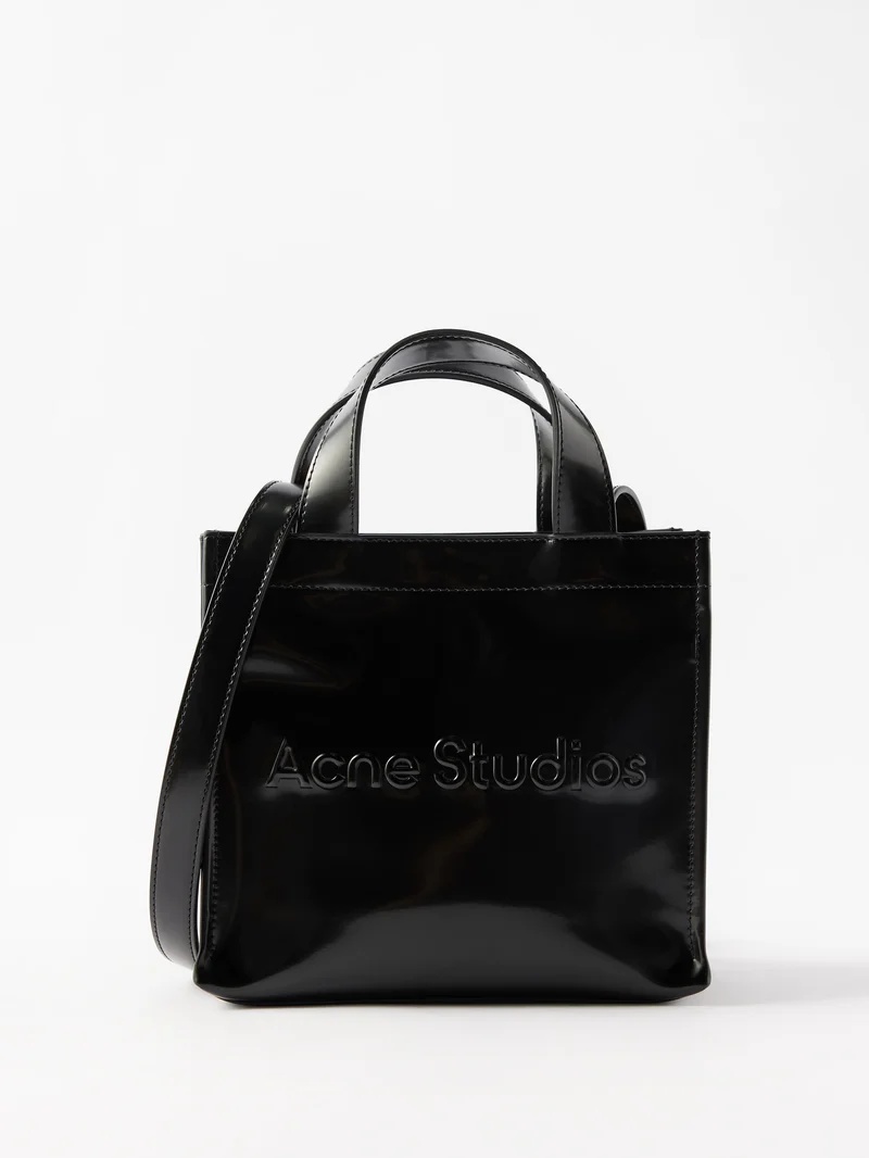 Acne Studios Logo-embossed faux leather cross-body bag matchesfashion  REVERSIBLE