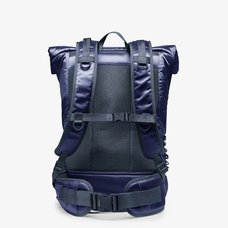 Rolltop blue nylon backpack decorated with enameled tone on tone Baguette buckle. Button and hidden  3