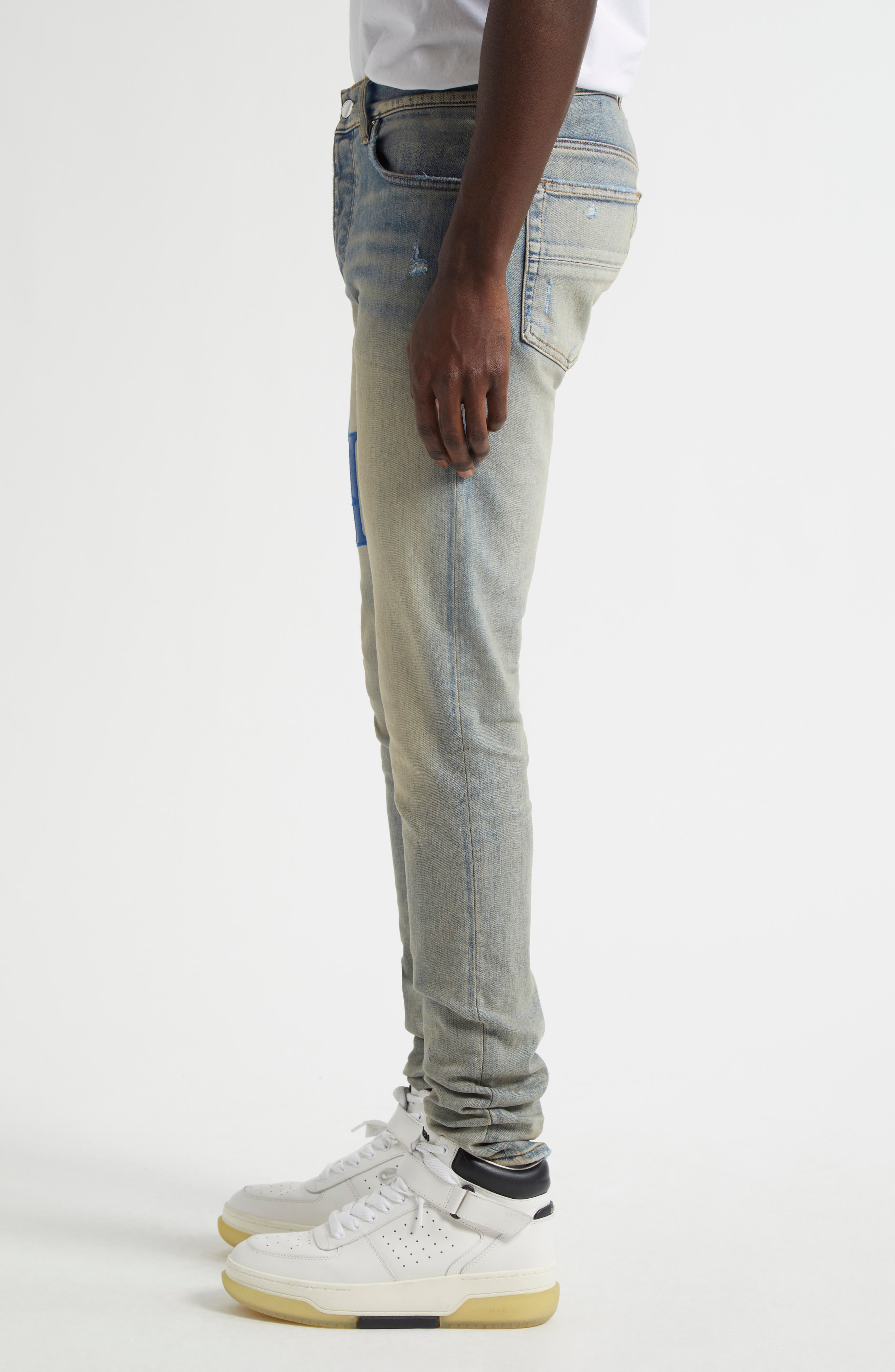 AMIRI Staggered Logo Skinny Jeans in Antique Indigo Blue at Nordstrom - 4