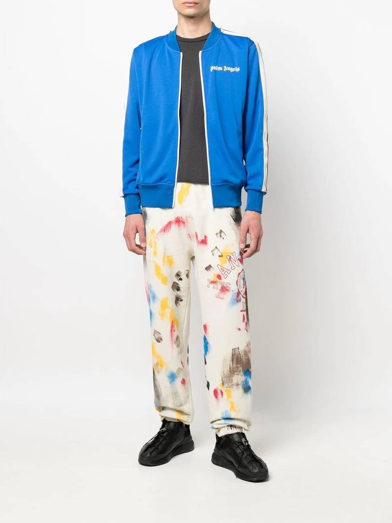 Palm Angels paint-splatter logo-print track pants outlook