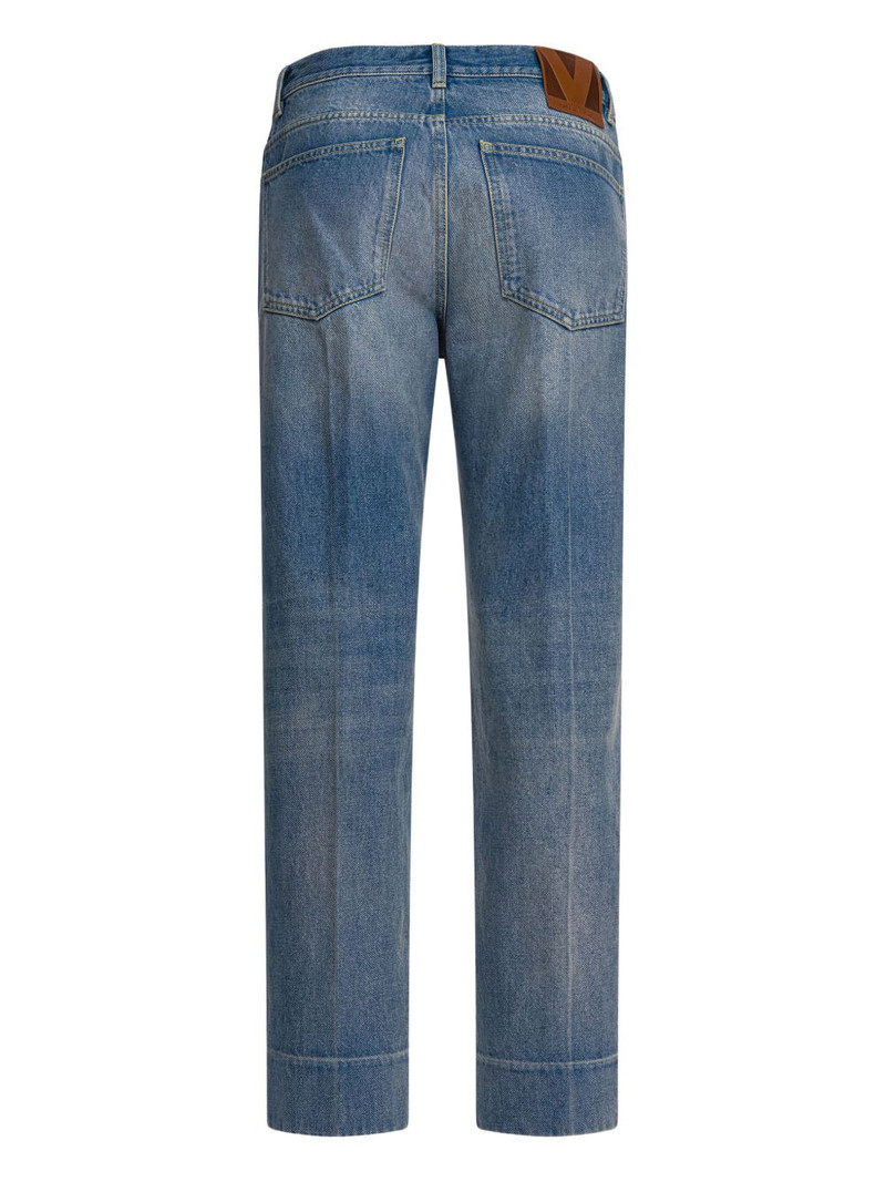 Valentino logo-patch cuffed denim jeans outlook
