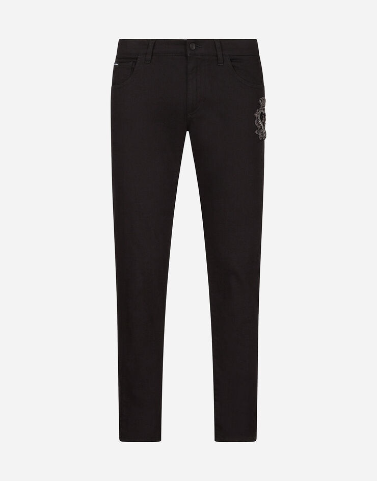 Black skinny stretch jeans with patch detailing - 1