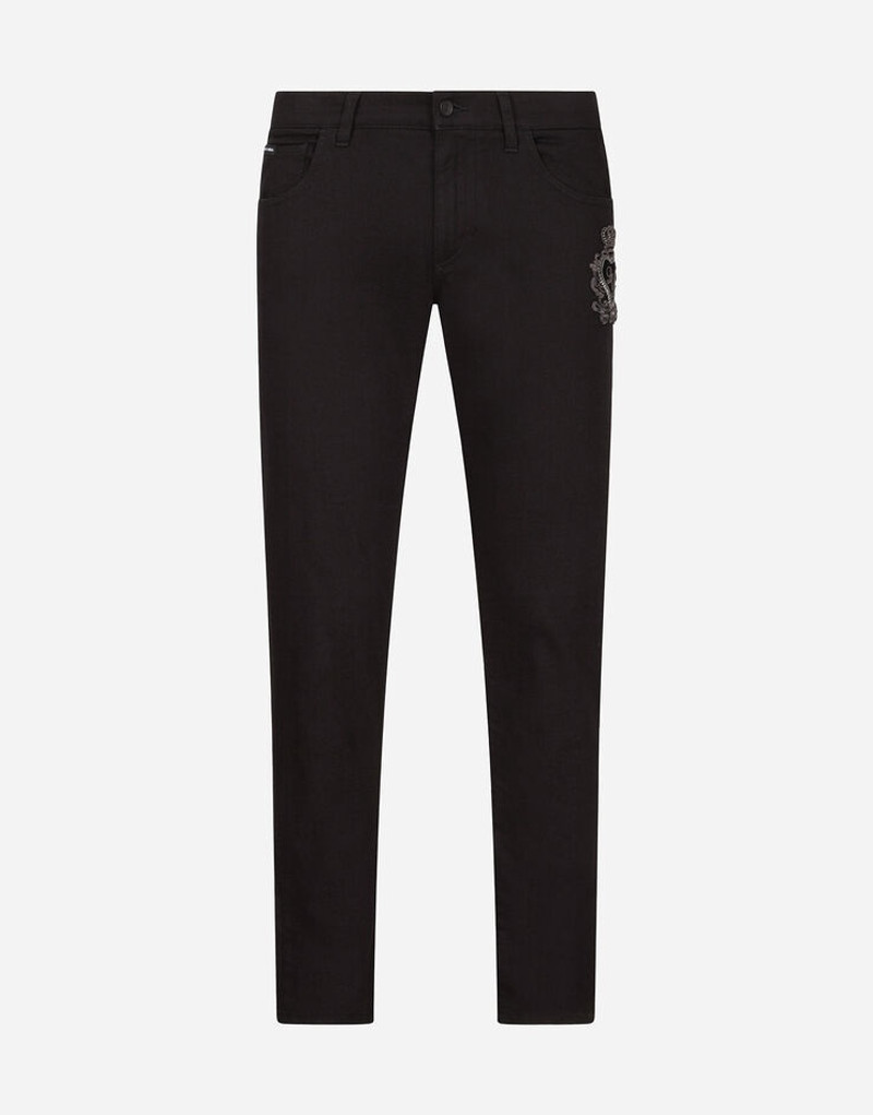 Black skinny stretch jeans with patch detailing 1