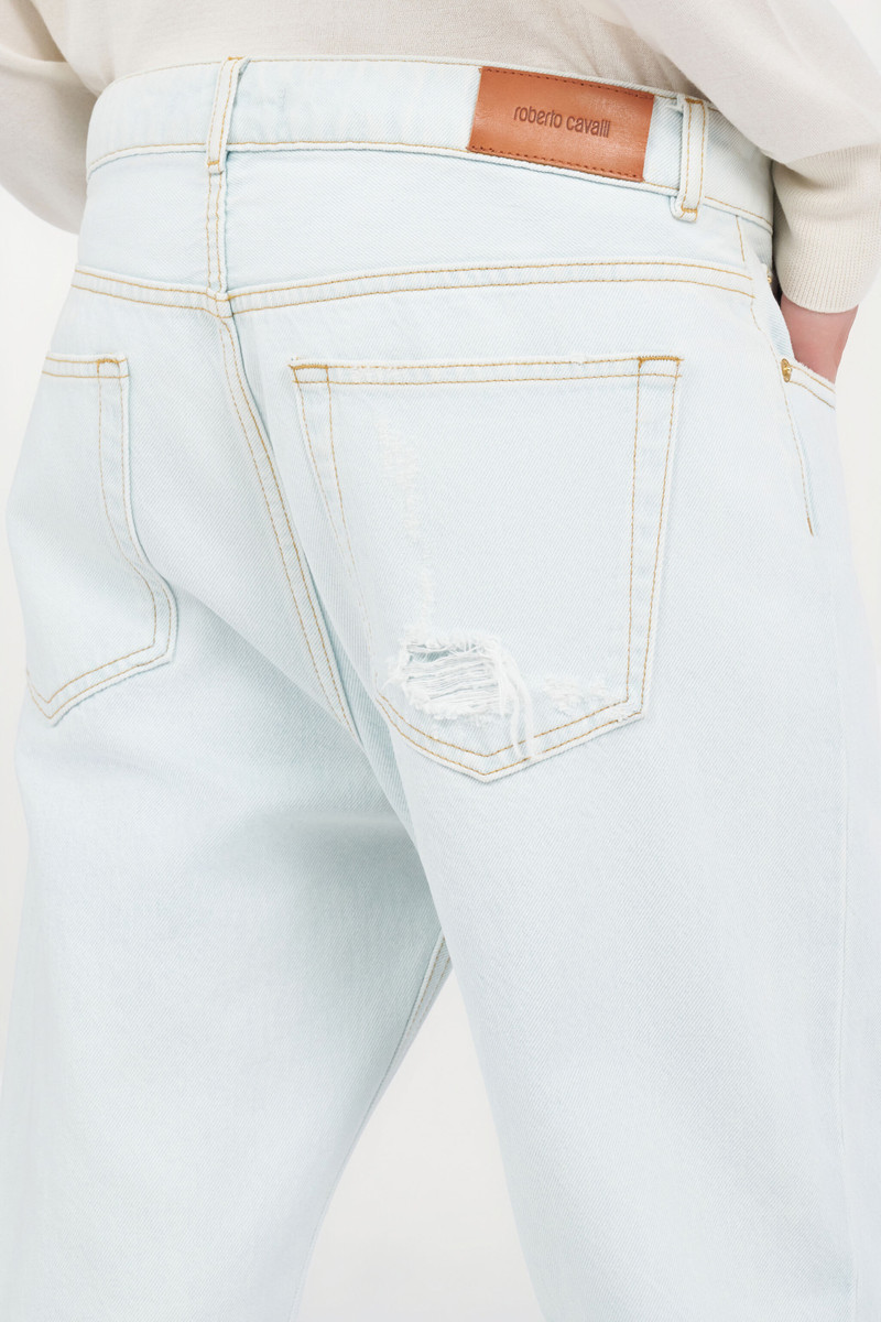 Light-Wash Denim Jeans with Distressed Details 7