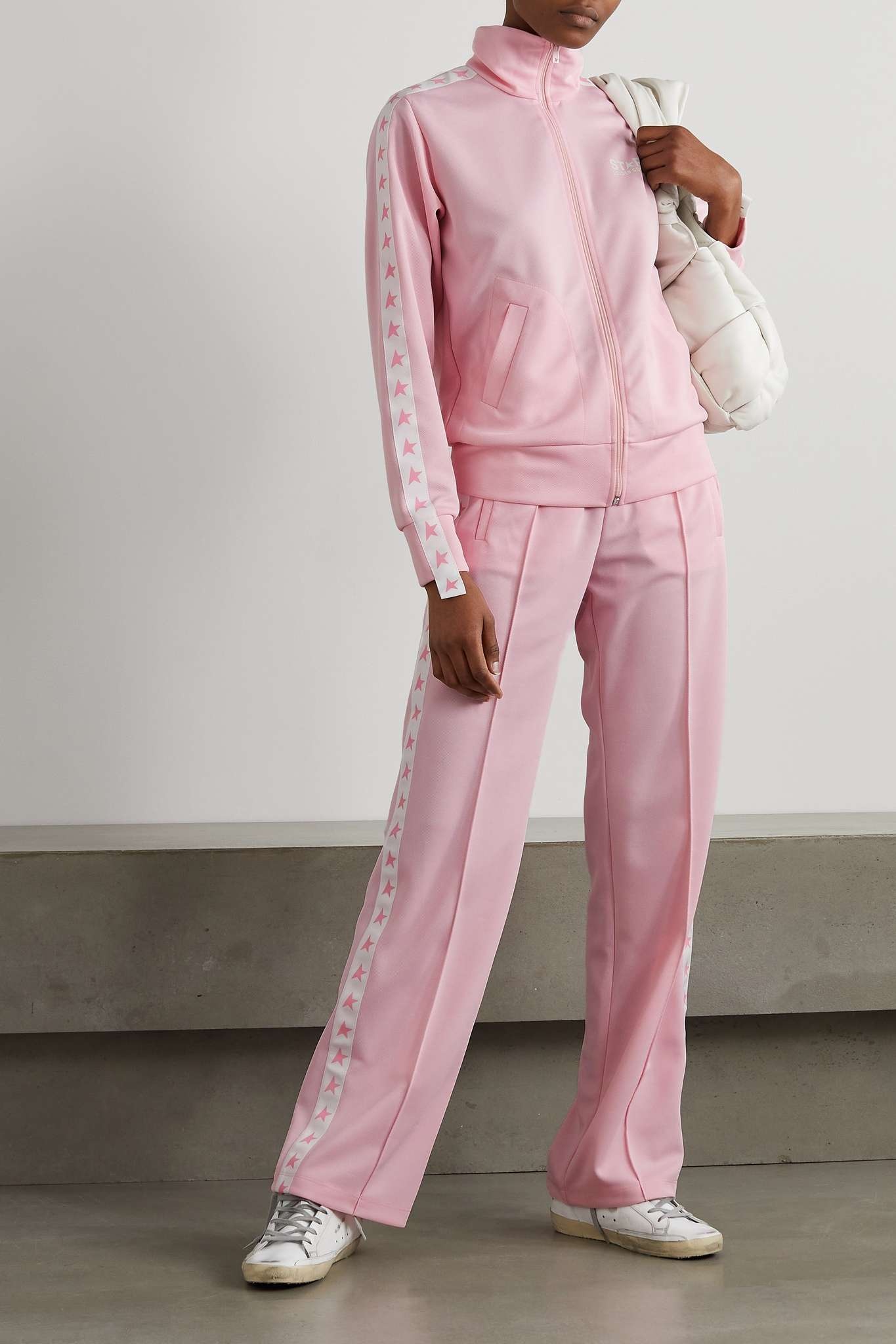 Women's pink joggers with band and stars on the sides