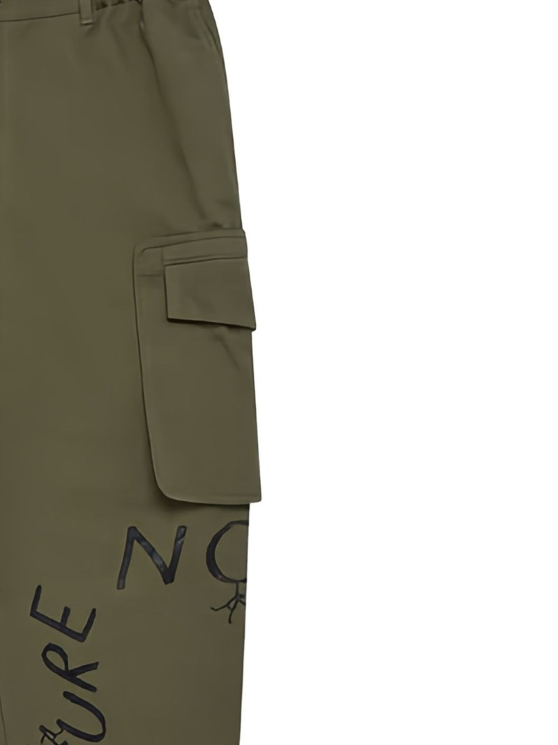 Comme des Garçons SHIRT text-print trousers outlook