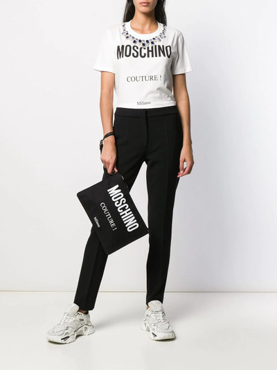 Moschino logo-print clutch bag outlook