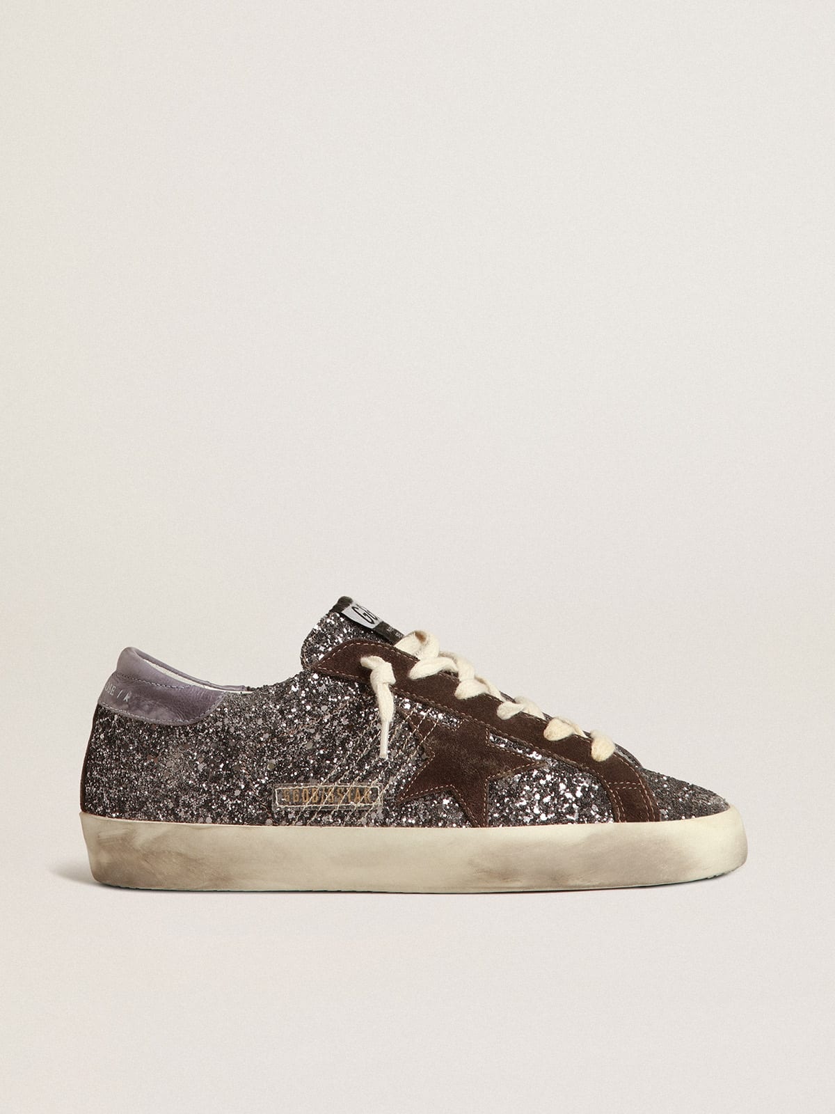 Golden Goose Super-Star in glitter with a brown star and lilac