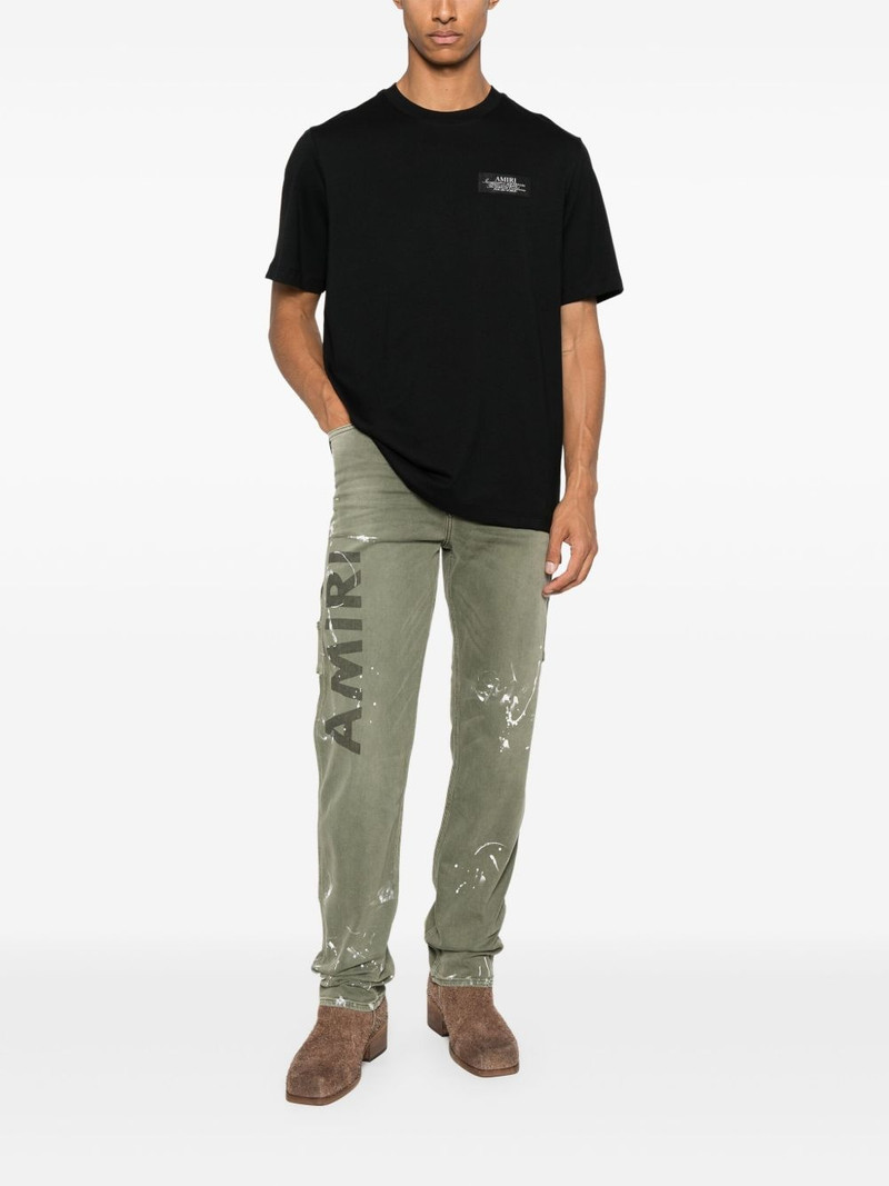 AMIRI logo-print stretch-cotton jeans outlook