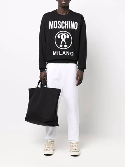 Moschino logo print track pants outlook