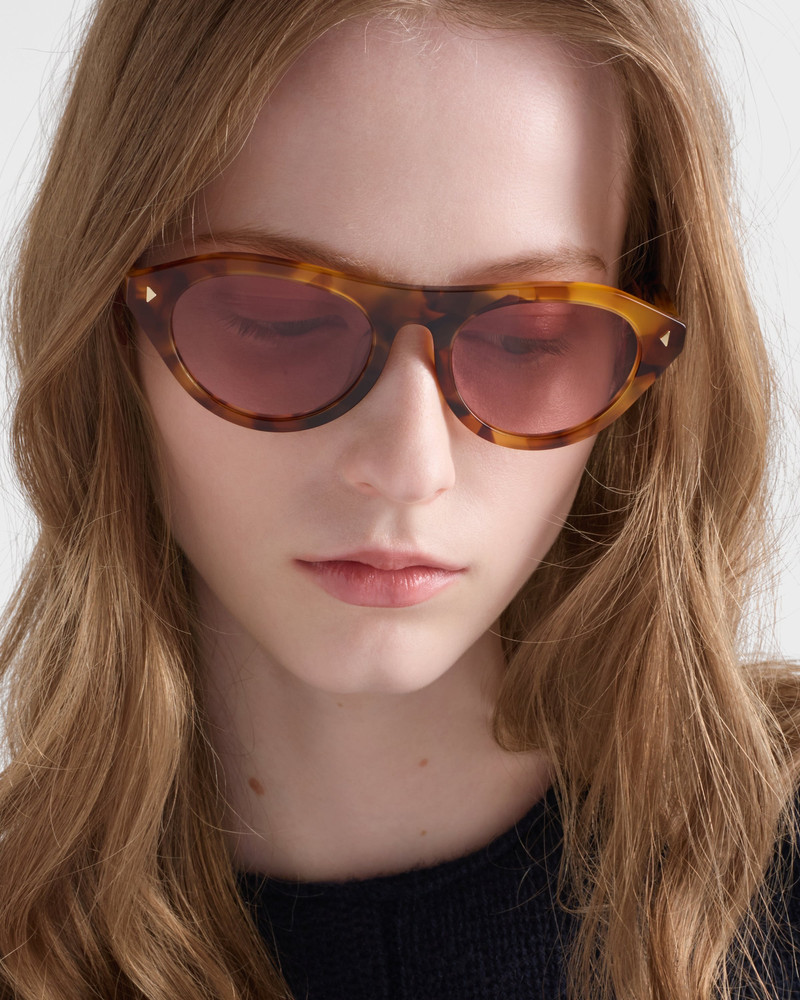 Prada Prada sunglasses with the iconic metal plaque outlook