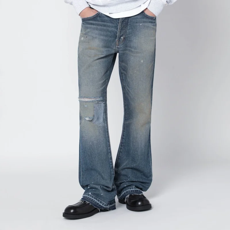Faded indigo jeans with rips - 1