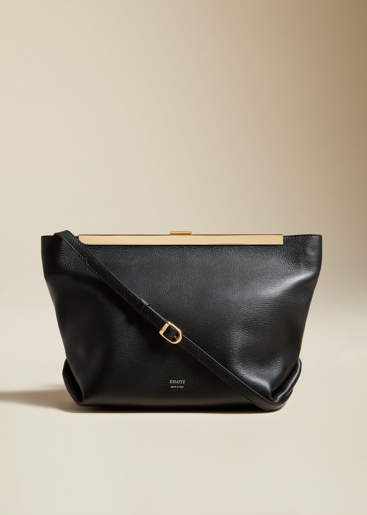 Shop Khaite Augusta Envelope Pleat Frame Leather Crossbody Bag