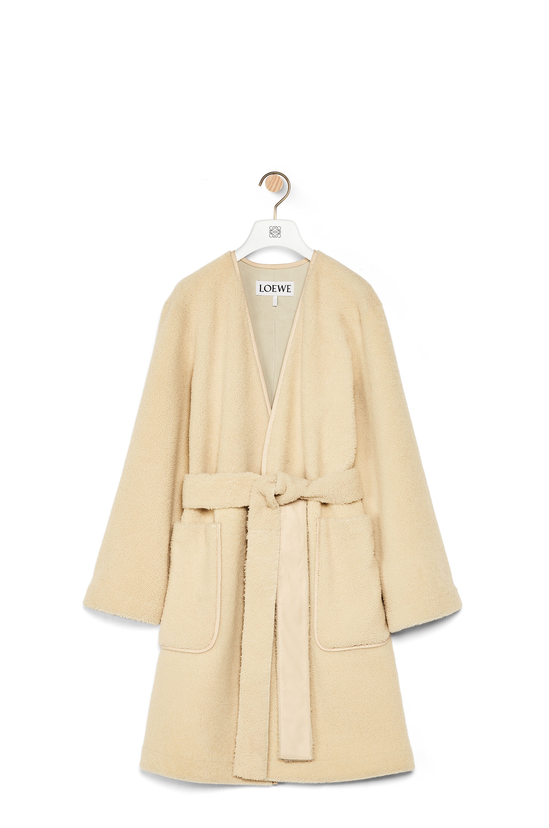 Collarless wrap coat in shearling - 1