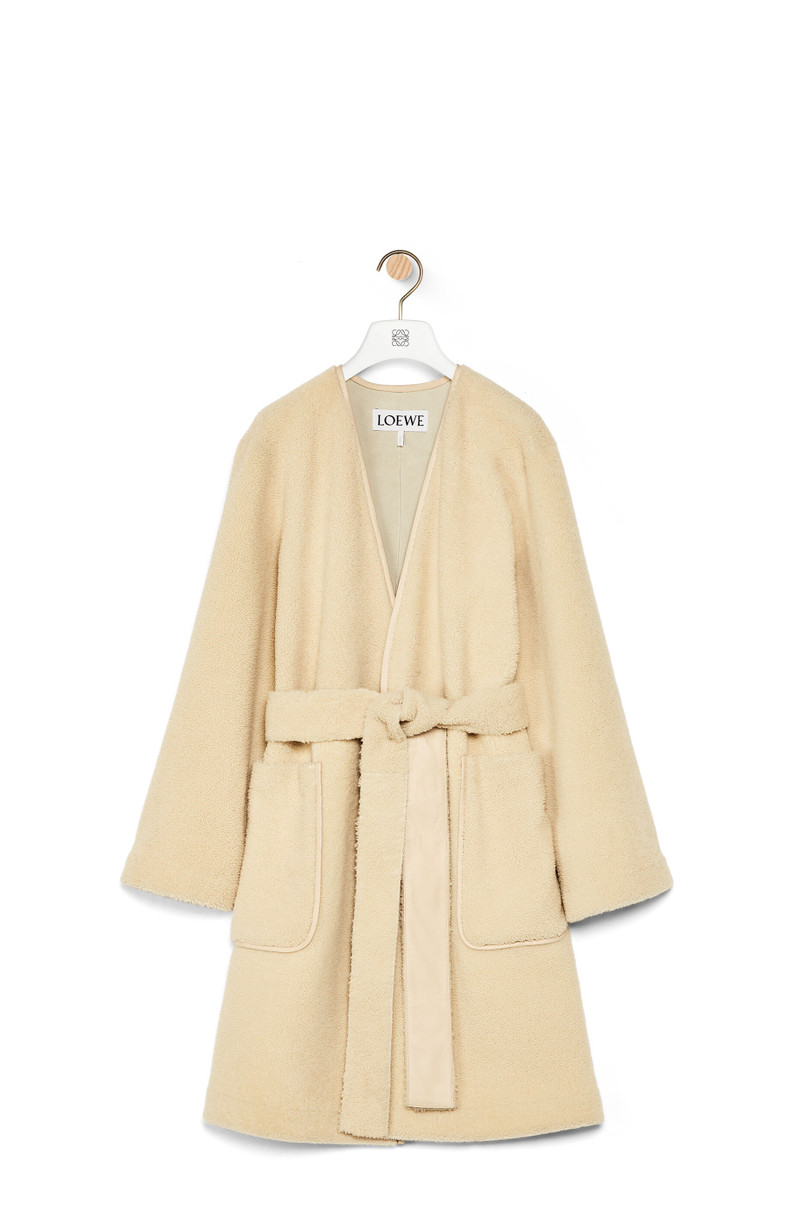 Collarless wrap coat in shearling 1
