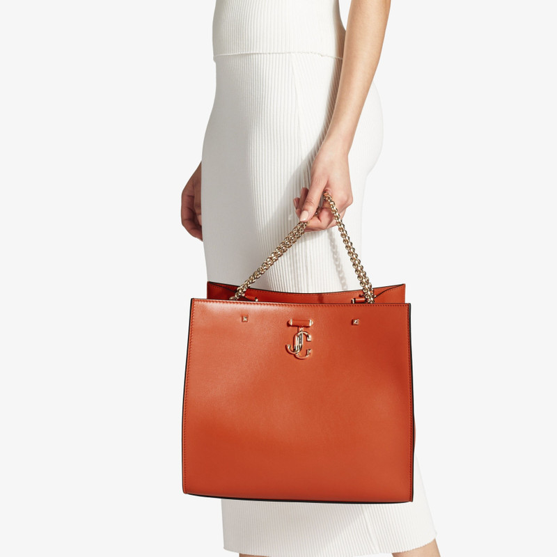 JIMMY CHOO Varenne Tote Bag
Dark Amber Orange Fine Shiny Calf Leather Tote Bag with Light Gold JC Emblem outlook