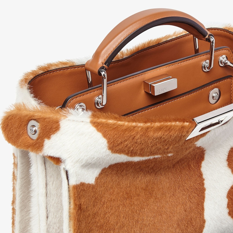 FENDI Small Peekaboo ISeeU bag made of sheepskin printed with brown and white cowhide motif. The interior  outlook