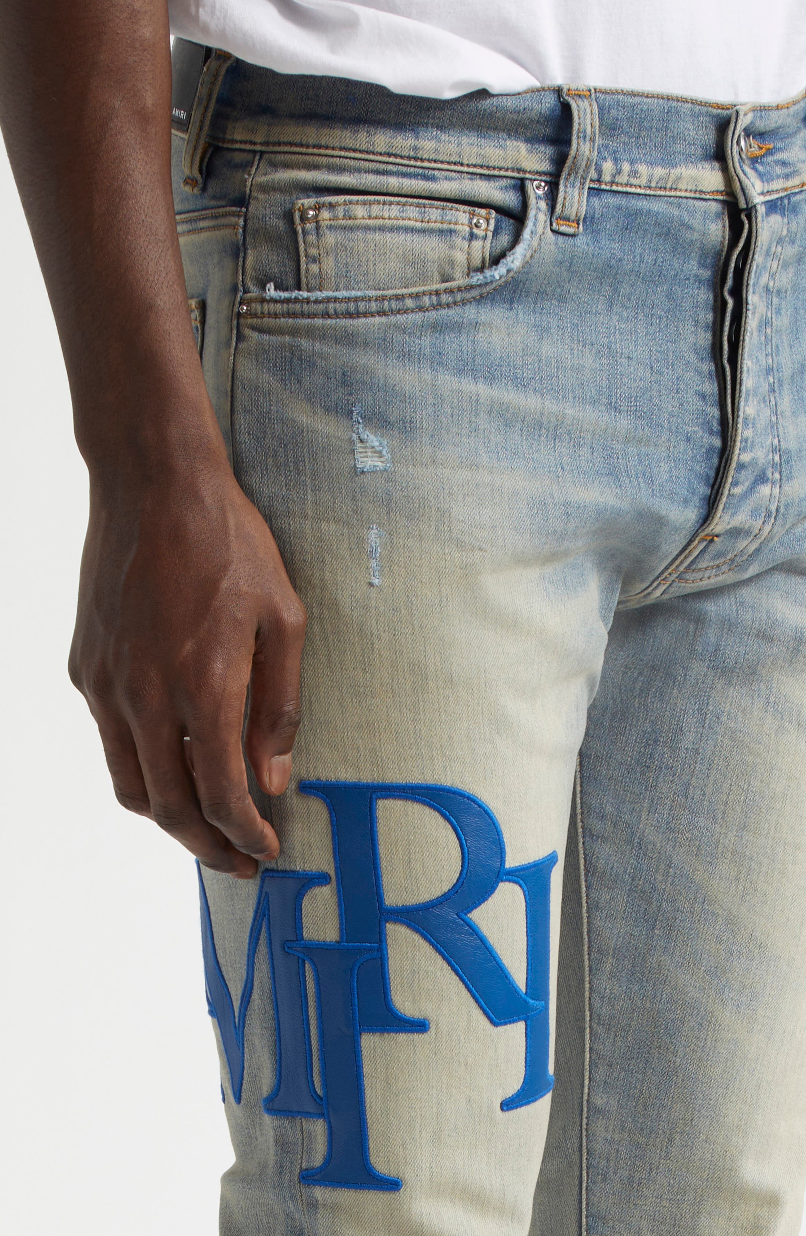 AMIRI Staggered Logo Skinny Jeans in Antique Indigo Blue at Nordstrom - 5