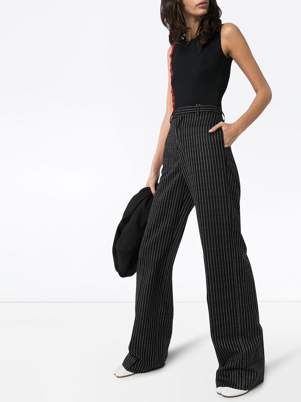 Black sleeveless stretch jersey bodysuit with white Four stitches at back. - 2