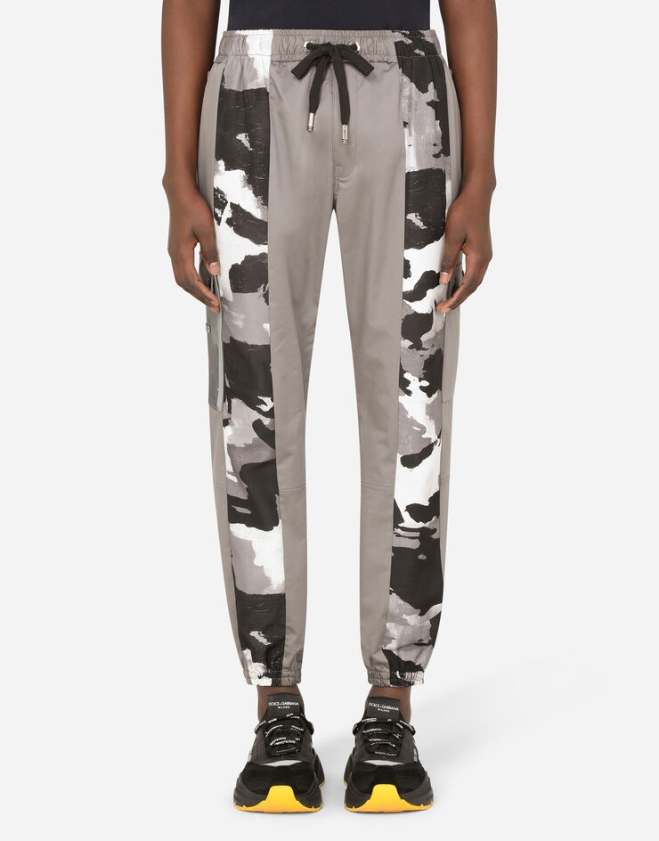 Cotton jogging pants with camouflage- print details - 1