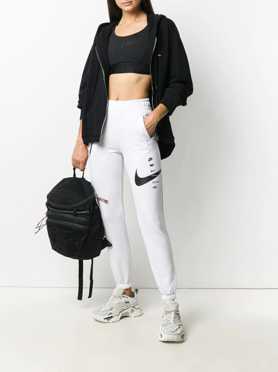 Nike Swoosh logo print track pants outlook