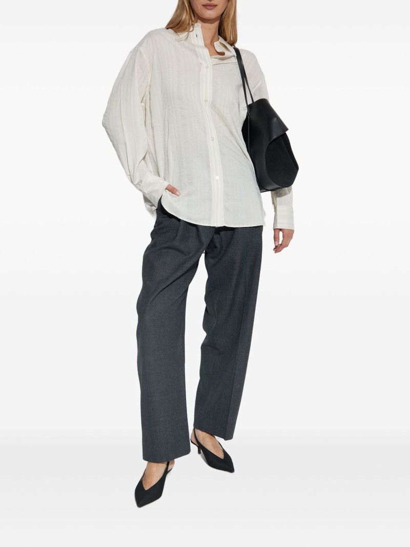 Studio Nicholson pleated tapered wool trousers outlook