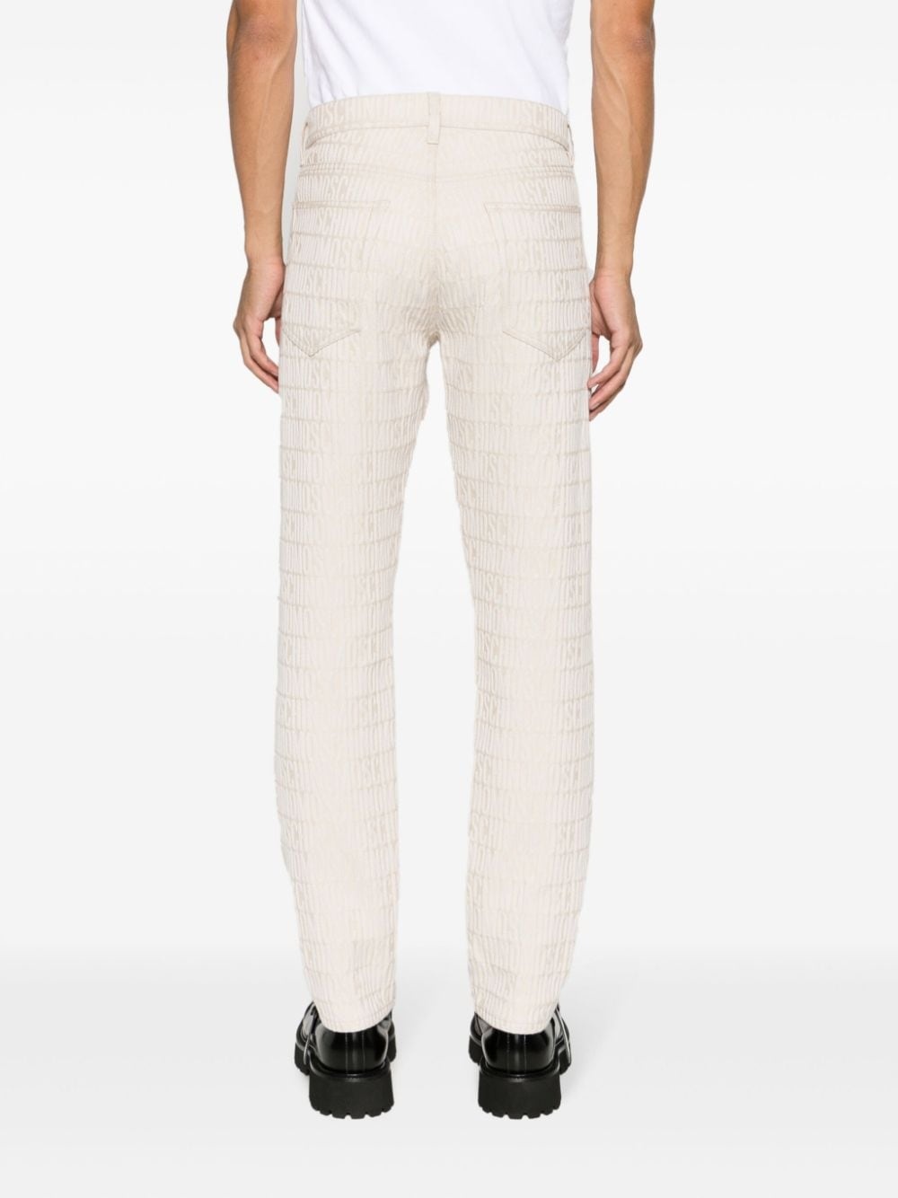 slim-cut logo-embossed jeans - 4