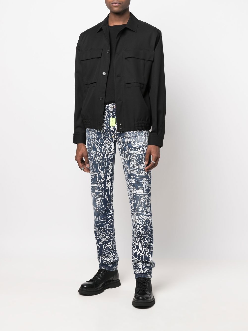 all-over graphic-print jeans - 2