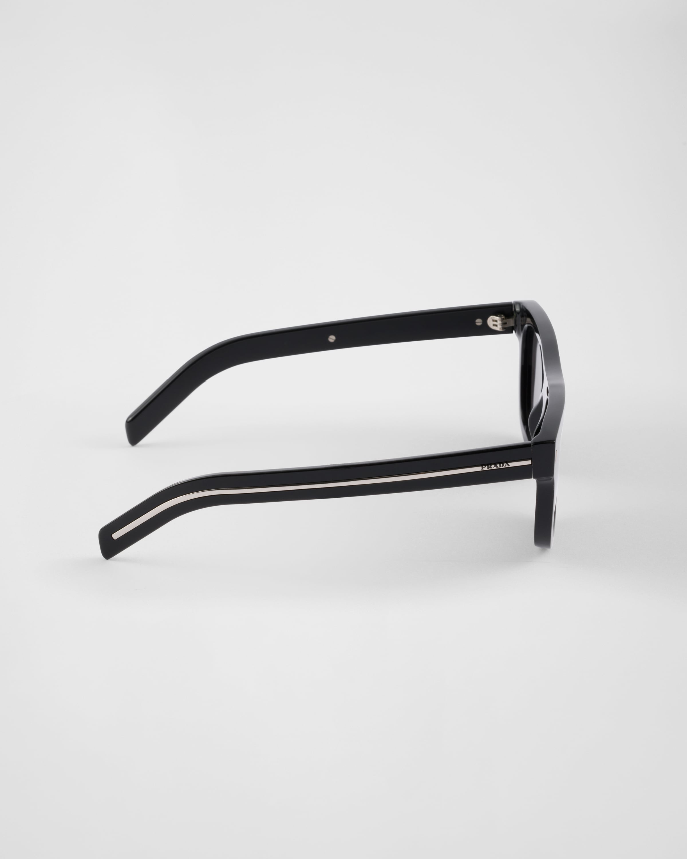 Prada Sunglasses with the iconic metal plaque | REVERSIBLE