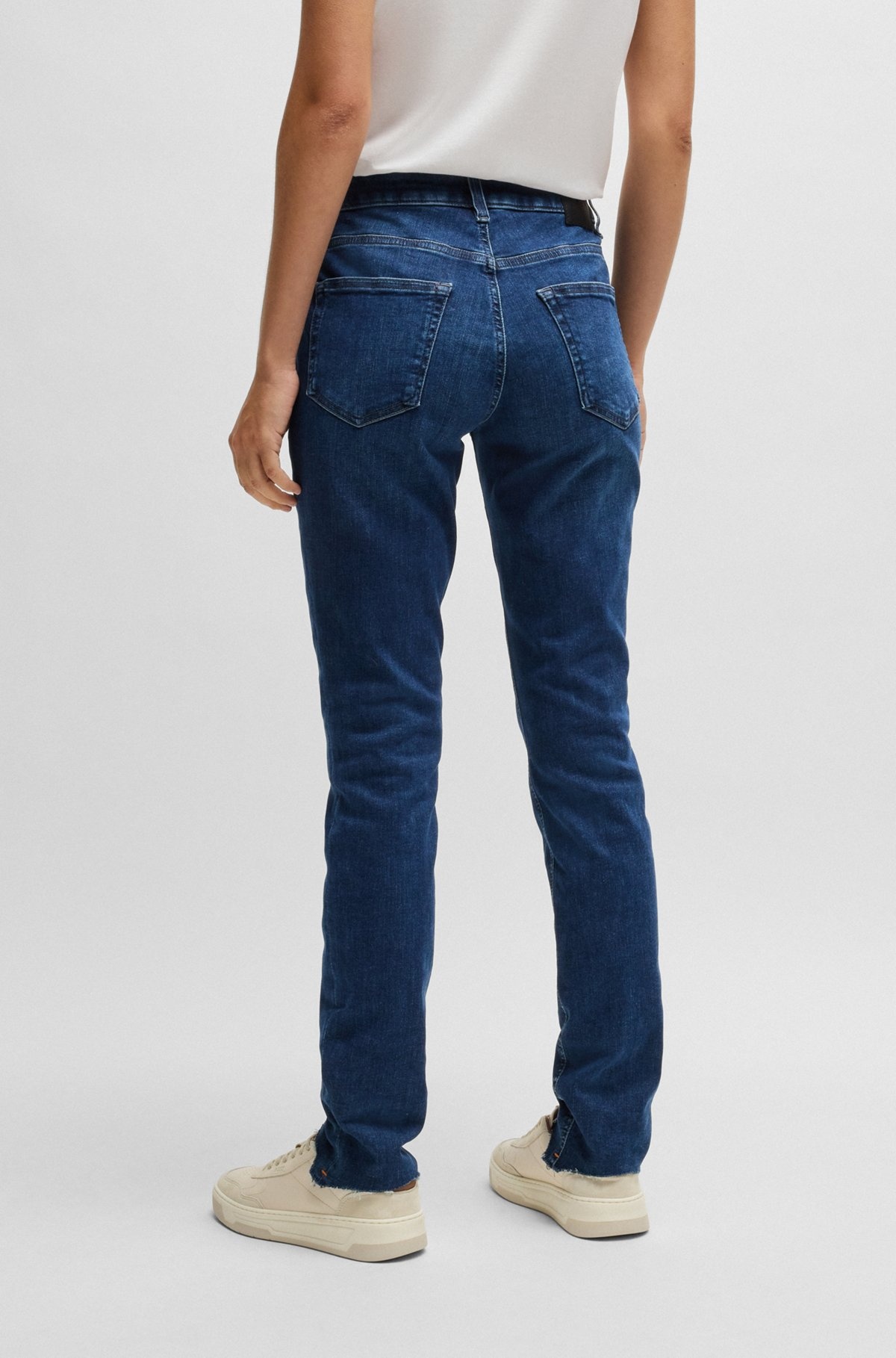 BLUE JEANS IN DISTRESSED STRETCH DENIM WITH FRAYED HEMS - 4