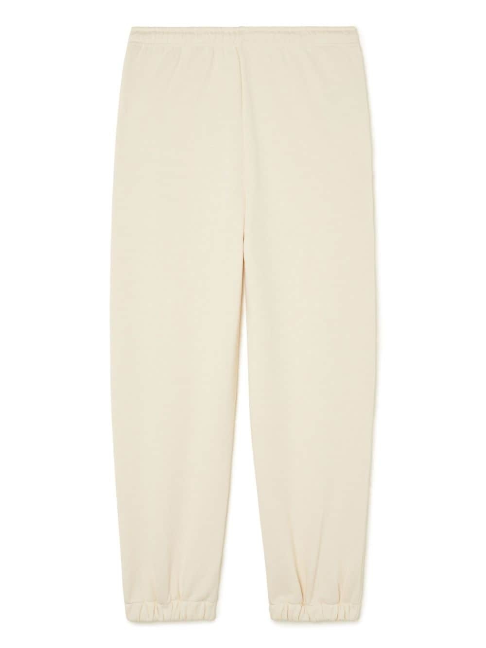 bead-embellished tapered trousers - 7