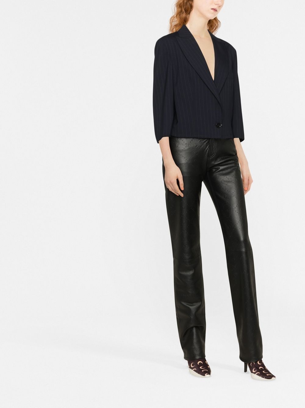 all-over embossed-logo leather trousers - 2
