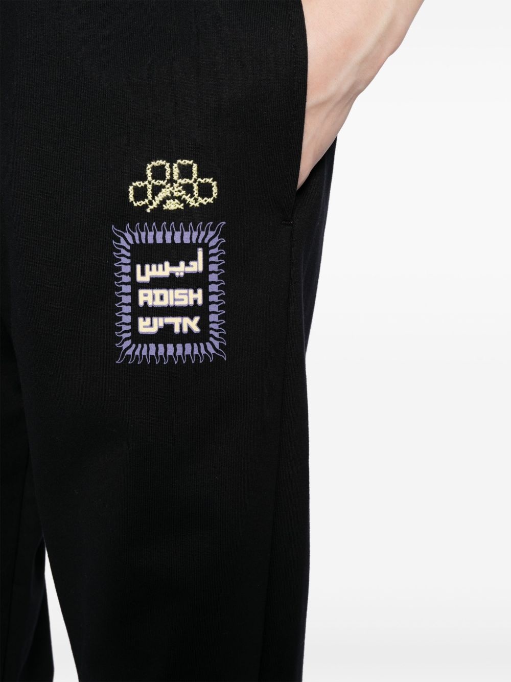 Alkhws logo-print cotton track pants - 5