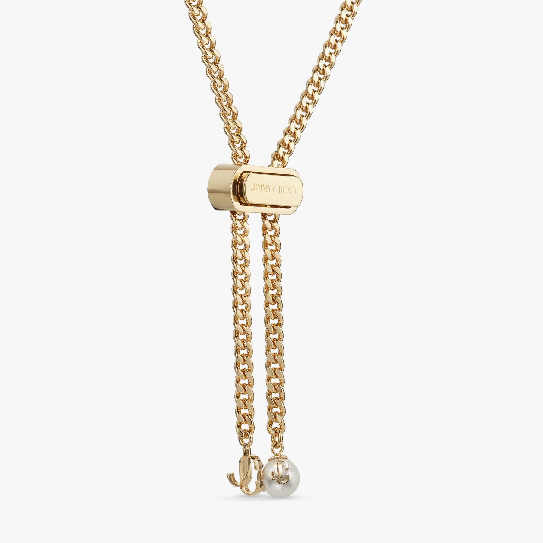 Bon Bon Necklace
Gold-Finish Metal Necklace with Pearl and JC Charm - 5