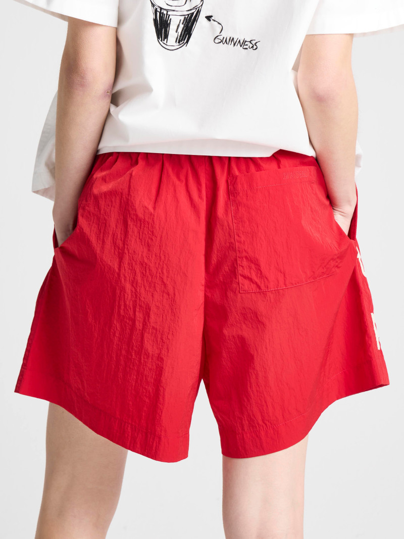 Unisex JW ANDERSON X GUINNESS SLOGAN TRACK SHORTS IN RED 9