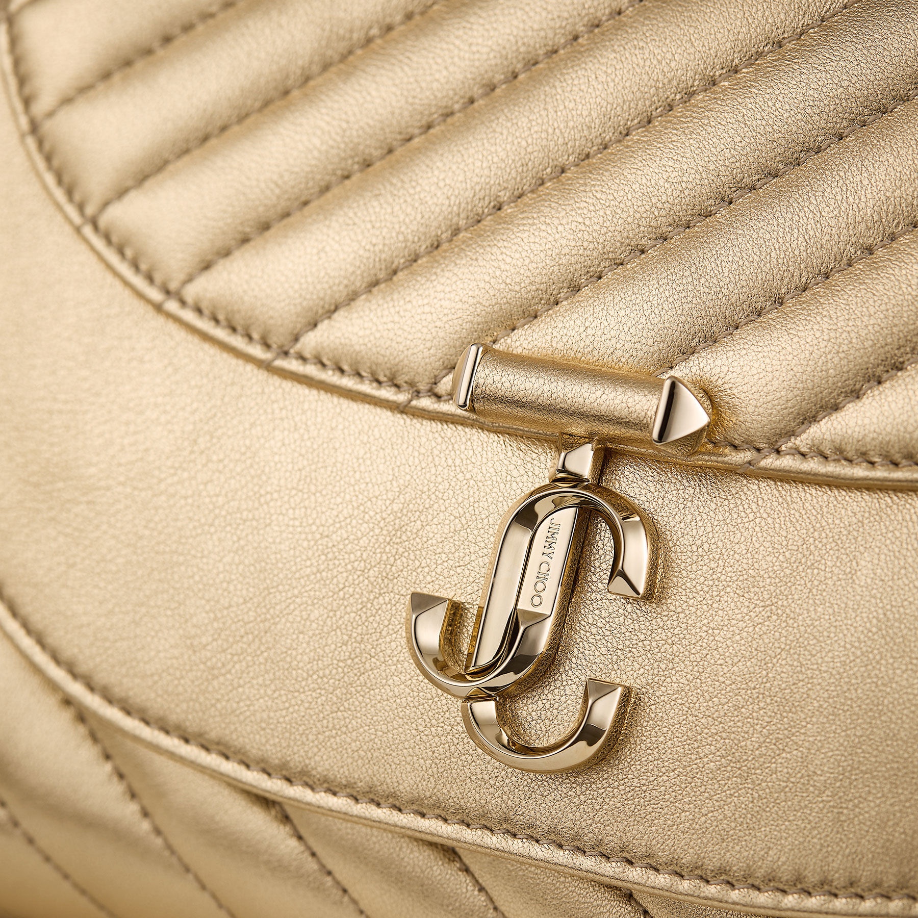Avenue Curve Clutch
Shiny Gold Quilted Metallic Leather Clutch with Chain - 4