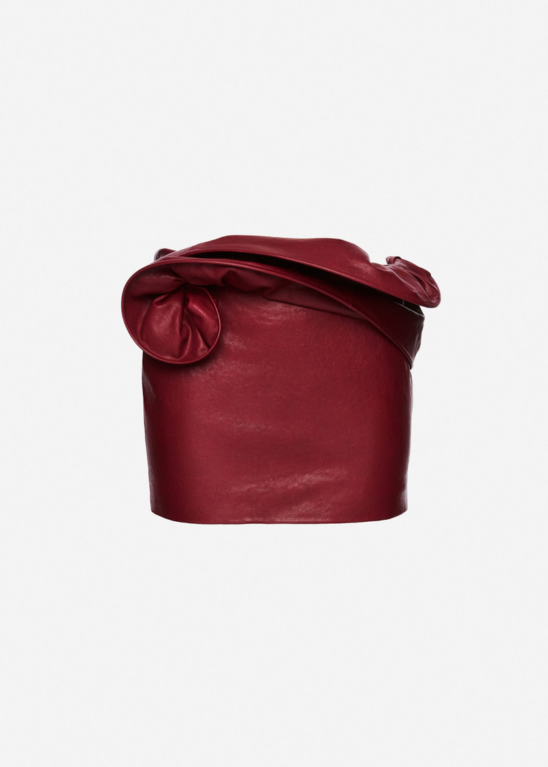 Mini leather skirt with hand-twisted flower detail in cherry red 1